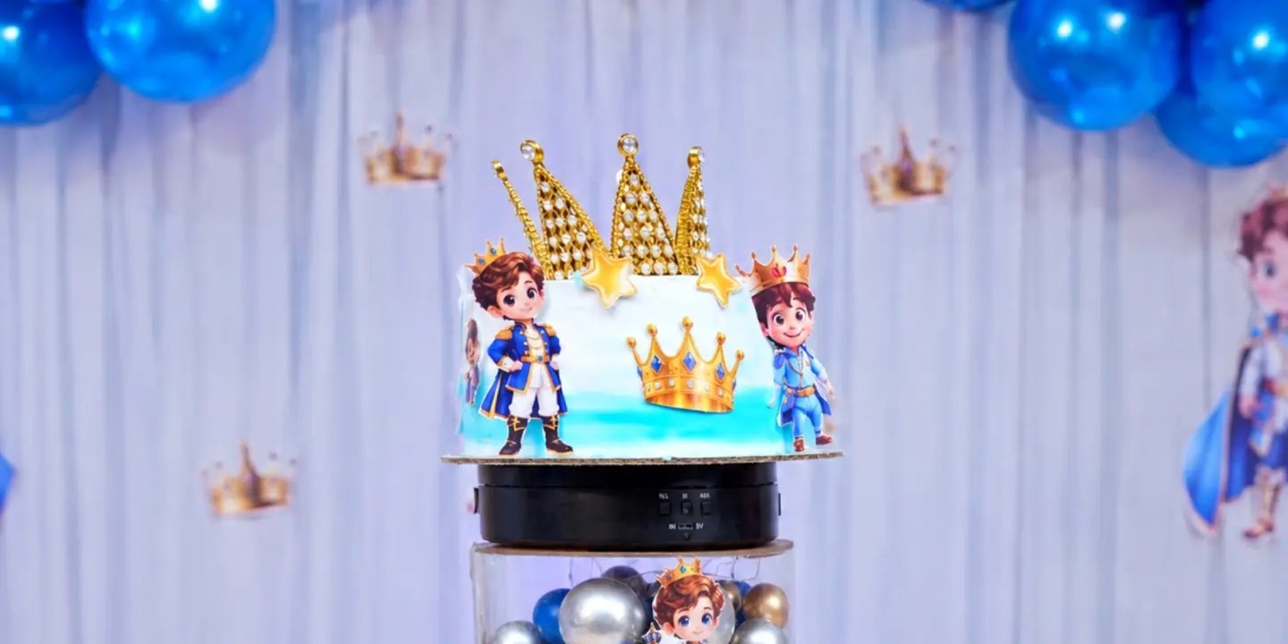 Royal prince theme cake with golden crowns
